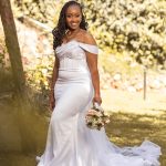 Sleeveless white mermaid wedding dress with off shoulder sleeves.