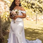 Sleeveless white mermaid wedding dress with off shoulder sleeves.